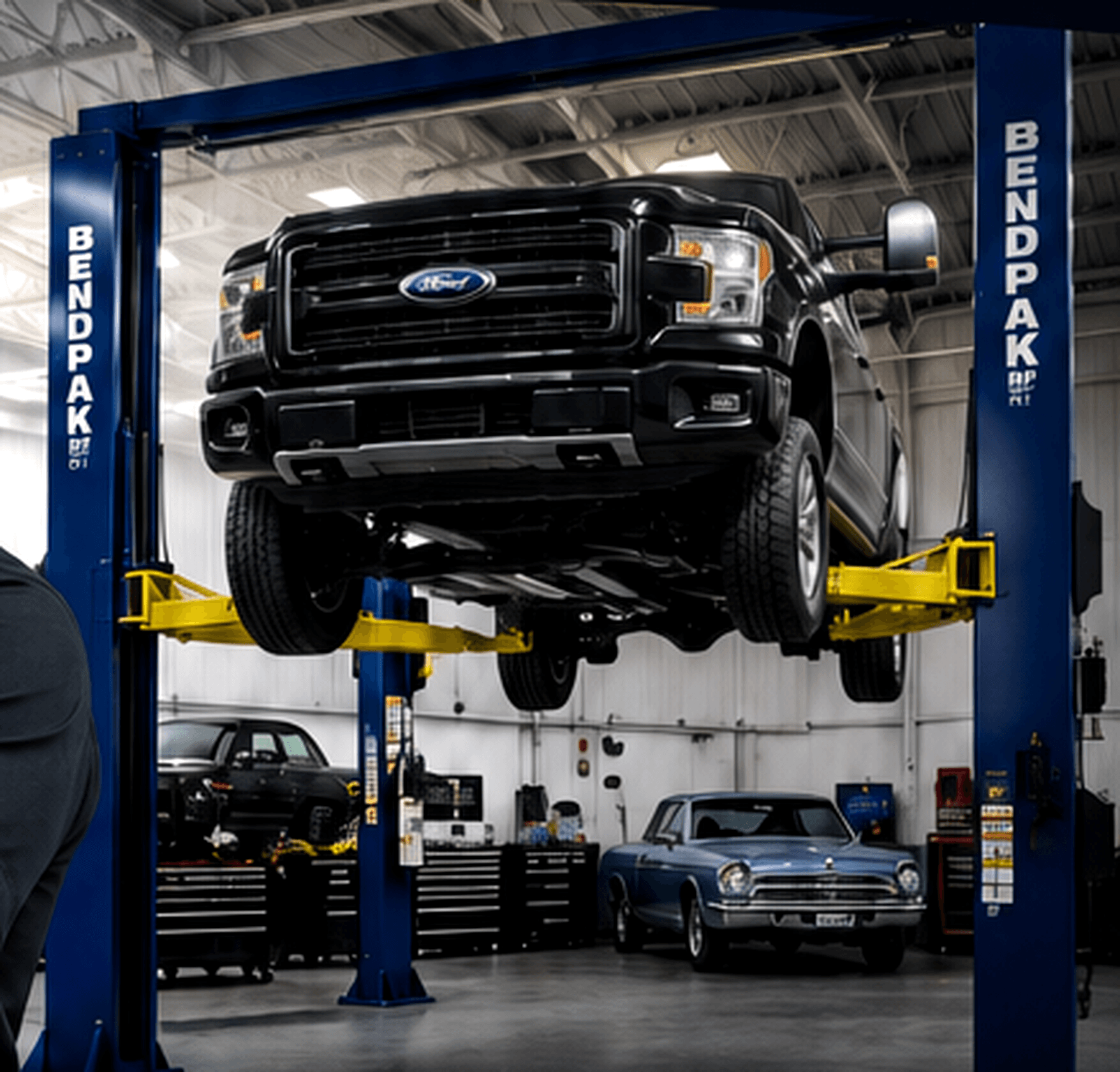 Black truck on a BendPak automotive lift