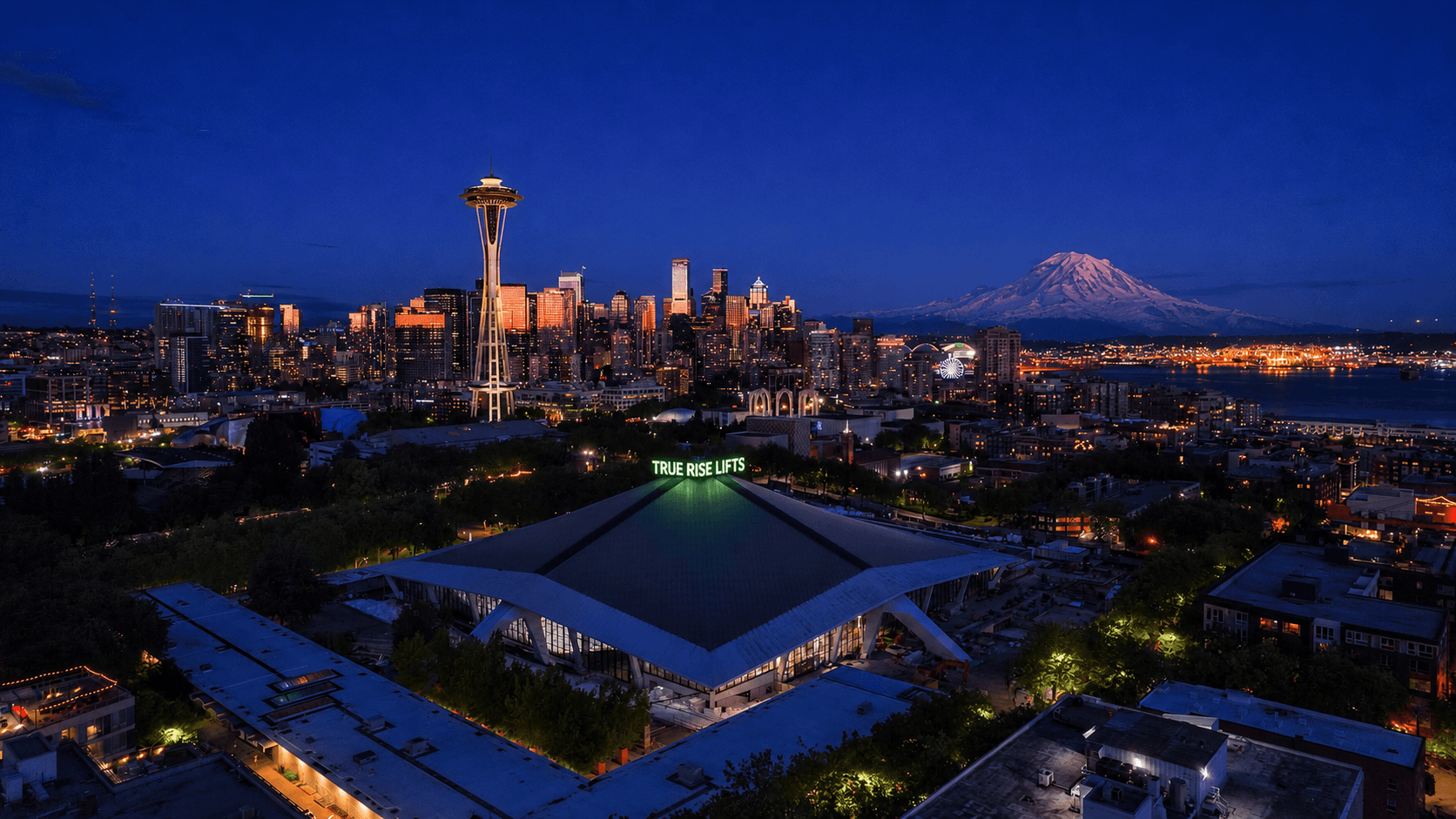 Seattle skyline, Space Needle, and Mount Rainier at night