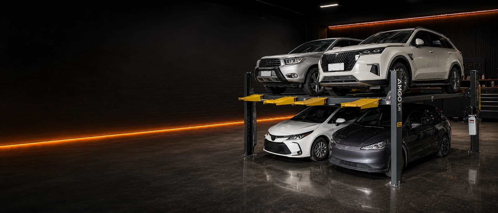 Four vehicles arranged on an automotive parking lift